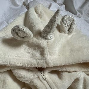 Unicorn zip up pajamas.